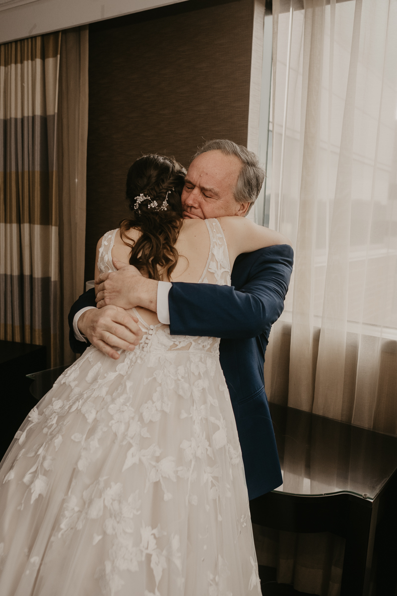 A bride getting ready at the Sheraton Baltimore North Hotel for a Mt. Washington Mill Dye House in Baltimore, Maryland by Britney Clause Photography