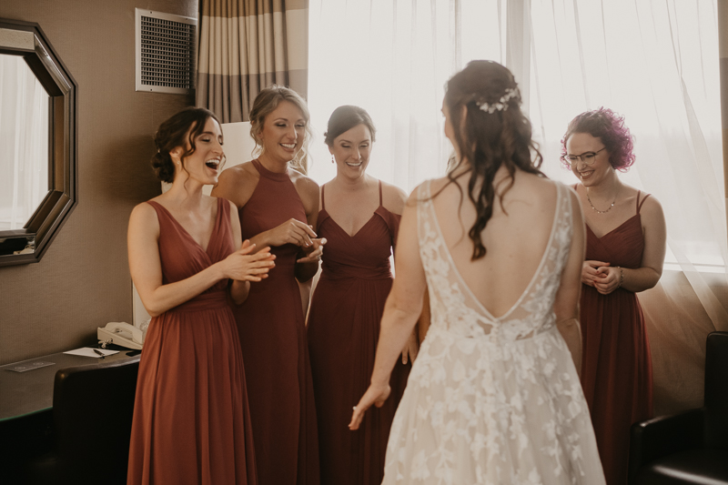 A bride getting ready at the Sheraton Baltimore North Hotel for a Mt. Washington Mill Dye House in Baltimore, Maryland by Britney Clause Photography