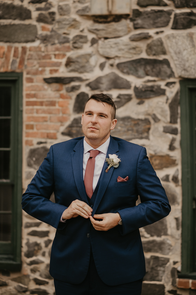 A groom getting ready at the Sheraton Baltimore North Hotel for a Mt. Washington Mill Dye House in Baltimore, Maryland by Britney Clause Photography