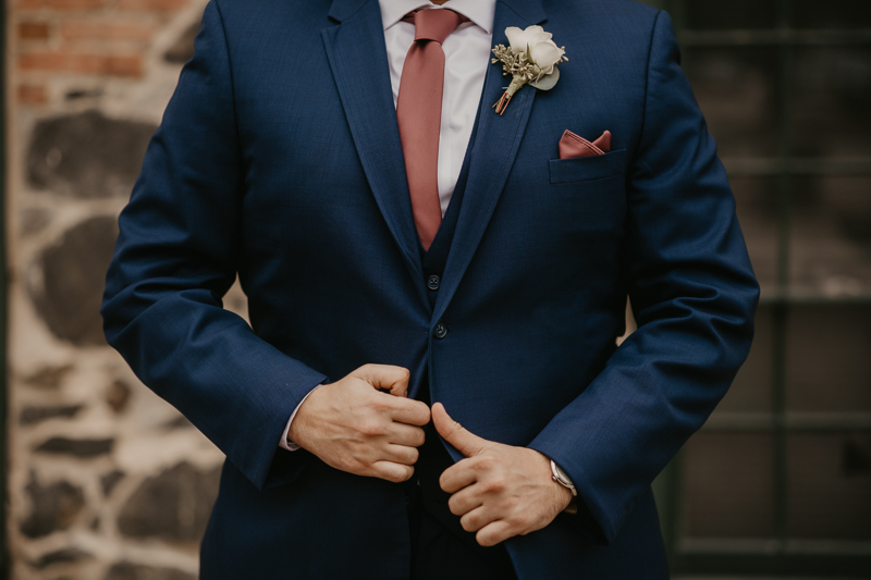 A groom getting ready at the Sheraton Baltimore North Hotel for a Mt. Washington Mill Dye House in Baltimore, Maryland by Britney Clause Photography