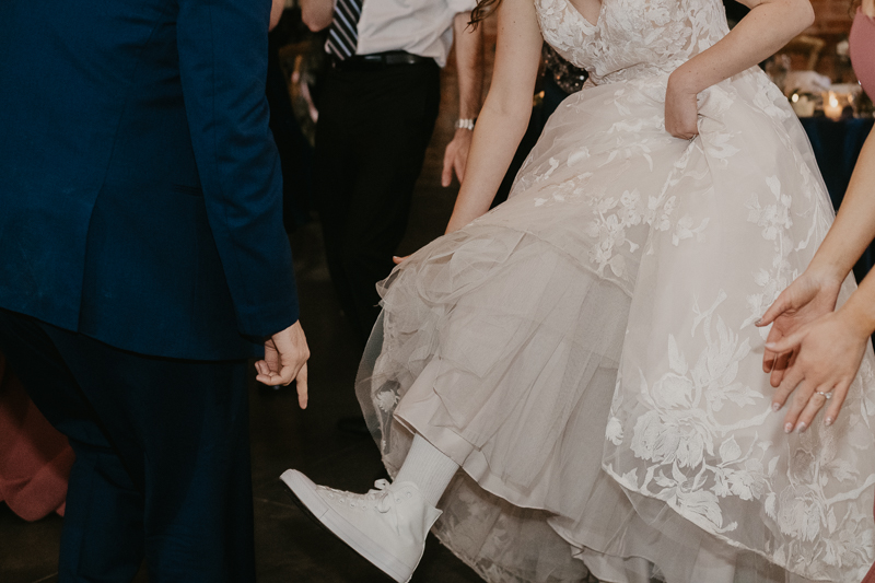 A bright and light filled evening wedding reception by District Remix DJs at the Mt. Washington Mill Dye House in Baltimore, Maryland by Britney Clause Photography