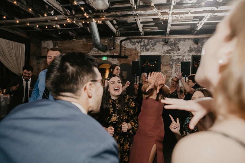 A bright and light filled evening wedding reception by District Remix DJs at the Mt. Washington Mill Dye House in Baltimore, Maryland by Britney Clause Photography