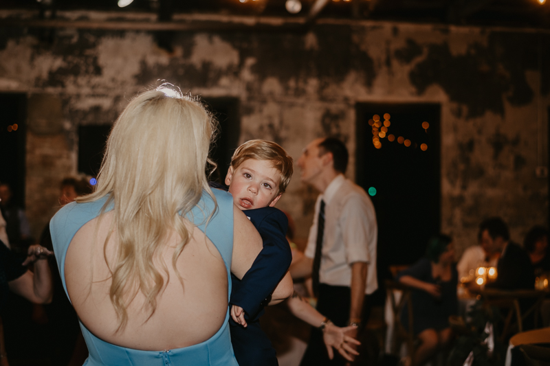 A bright and light filled evening wedding reception by District Remix DJs at the Mt. Washington Mill Dye House in Baltimore, Maryland by Britney Clause Photography