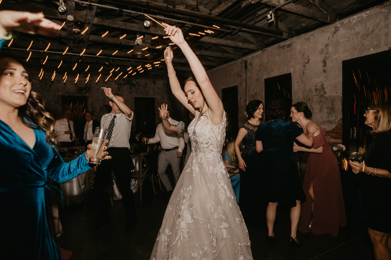 A bright and light filled evening wedding reception by District Remix DJs at the Mt. Washington Mill Dye House in Baltimore, Maryland by Britney Clause Photography