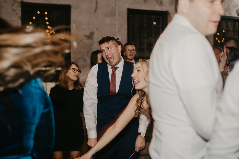 A bright and light filled evening wedding reception by District Remix DJs at the Mt. Washington Mill Dye House in Baltimore, Maryland by Britney Clause Photography