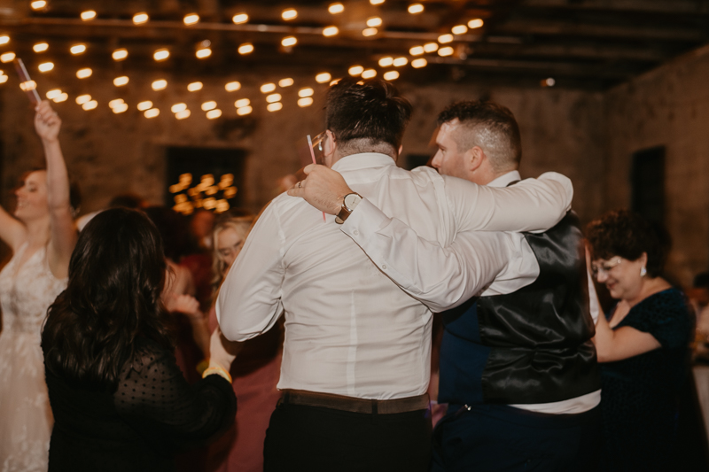 A bright and light filled evening wedding reception by District Remix DJs at the Mt. Washington Mill Dye House in Baltimore, Maryland by Britney Clause Photography