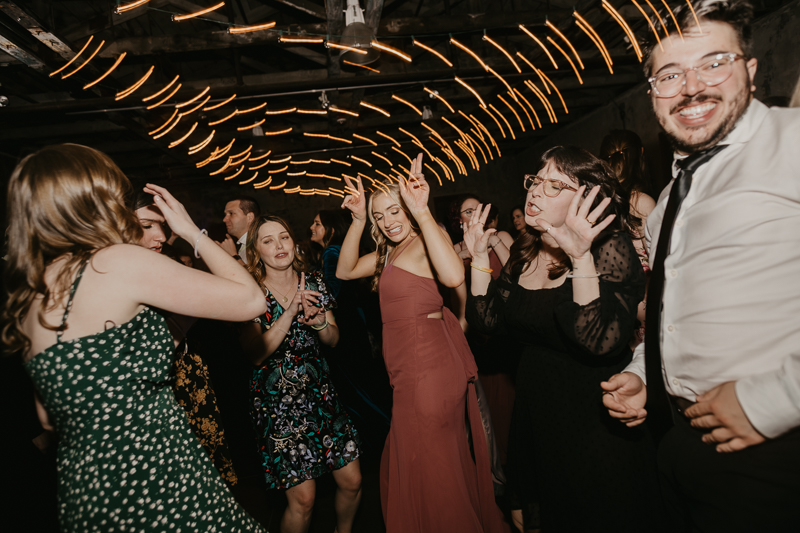 A bright and light filled evening wedding reception by District Remix DJs at the Mt. Washington Mill Dye House in Baltimore, Maryland by Britney Clause Photography