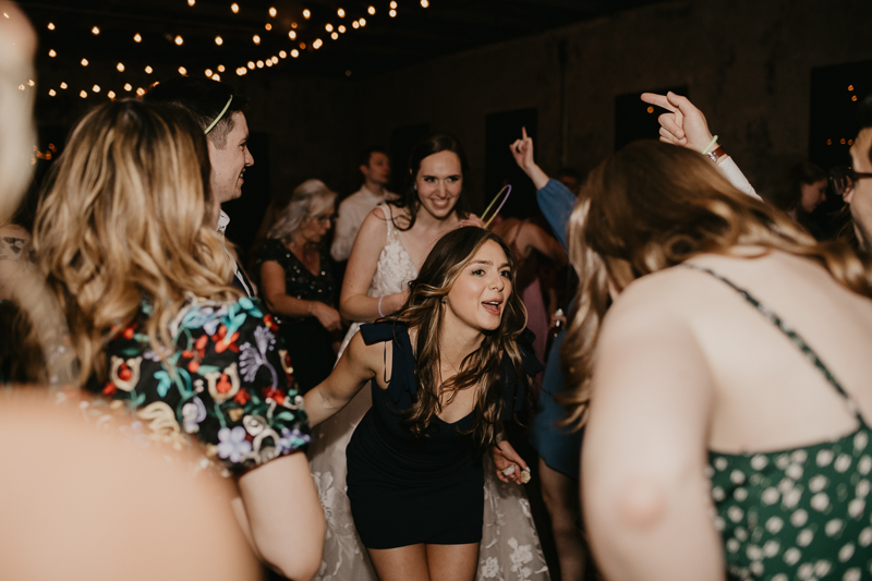 A bright and light filled evening wedding reception by District Remix DJs at the Mt. Washington Mill Dye House in Baltimore, Maryland by Britney Clause Photography