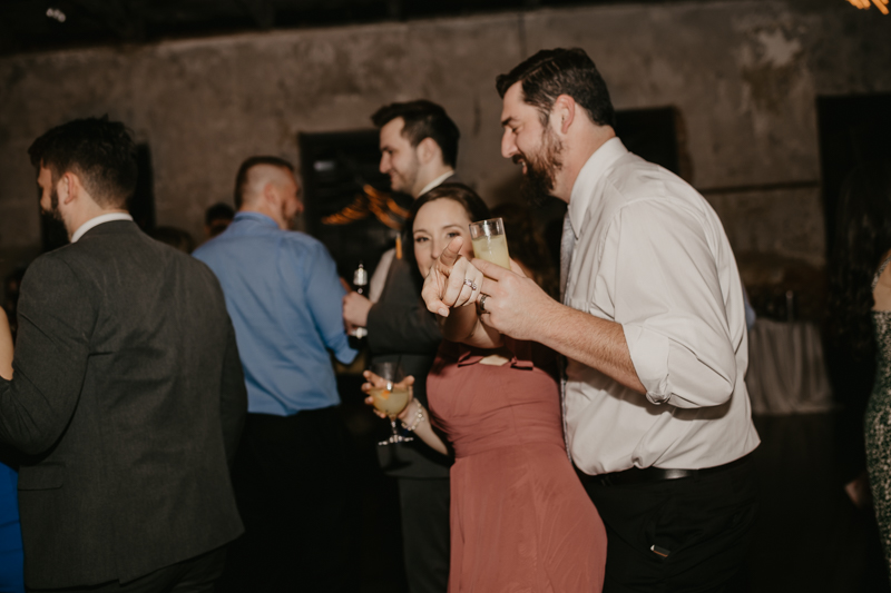 A bright and light filled evening wedding reception by District Remix DJs at the Mt. Washington Mill Dye House in Baltimore, Maryland by Britney Clause Photography