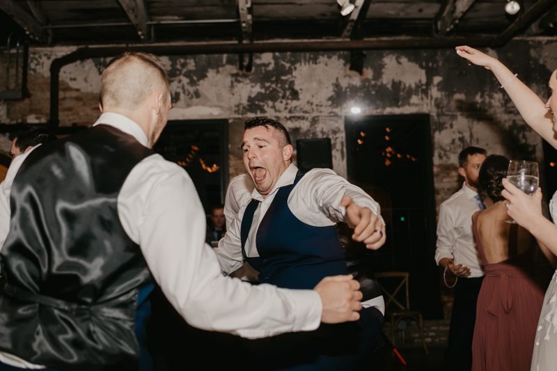 A bright and light filled evening wedding reception by District Remix DJs at the Mt. Washington Mill Dye House in Baltimore, Maryland by Britney Clause Photography