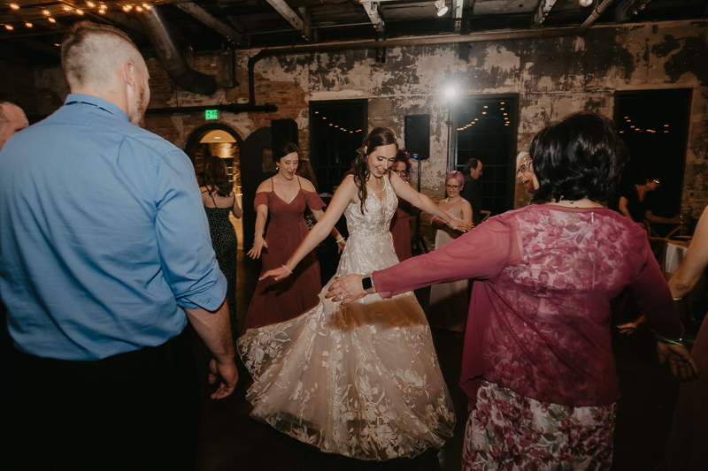 A bright and light filled evening wedding reception by District Remix DJs at the Mt. Washington Mill Dye House in Baltimore, Maryland by Britney Clause Photography