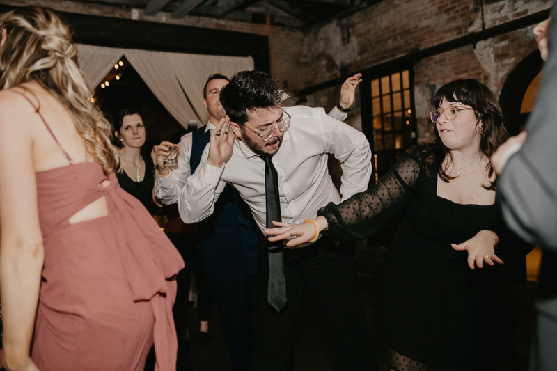 A bright and light filled evening wedding reception by District Remix DJs at the Mt. Washington Mill Dye House in Baltimore, Maryland by Britney Clause Photography