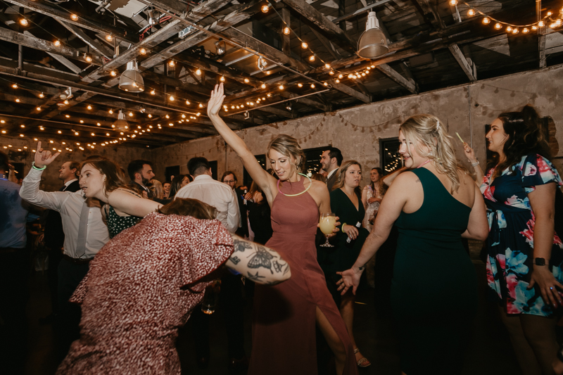 A bright and light filled evening wedding reception by District Remix DJs at the Mt. Washington Mill Dye House in Baltimore, Maryland by Britney Clause Photography