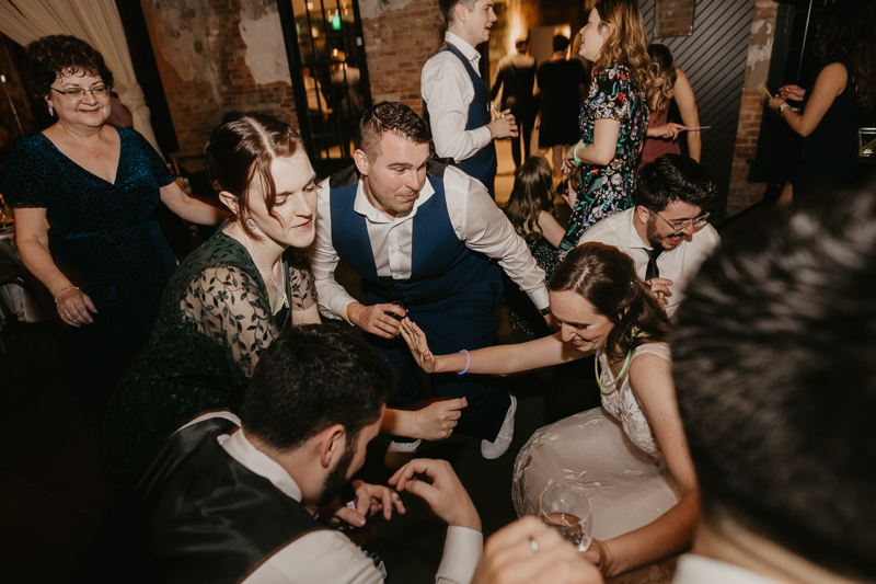 A bright and light filled evening wedding reception by District Remix DJs at the Mt. Washington Mill Dye House in Baltimore, Maryland by Britney Clause Photography