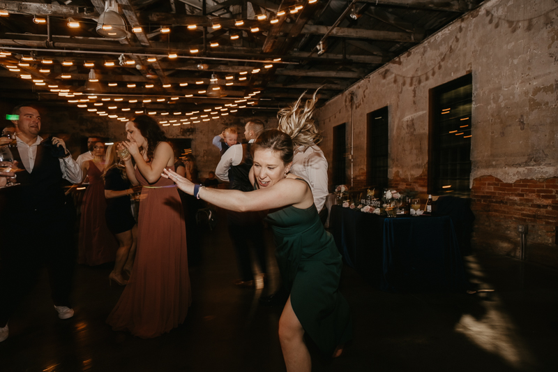 A bright and light filled evening wedding reception by District Remix DJs at the Mt. Washington Mill Dye House in Baltimore, Maryland by Britney Clause Photography