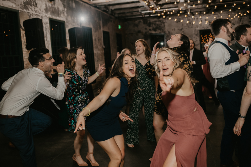 A bright and light filled evening wedding reception by District Remix DJs at the Mt. Washington Mill Dye House in Baltimore, Maryland by Britney Clause Photography