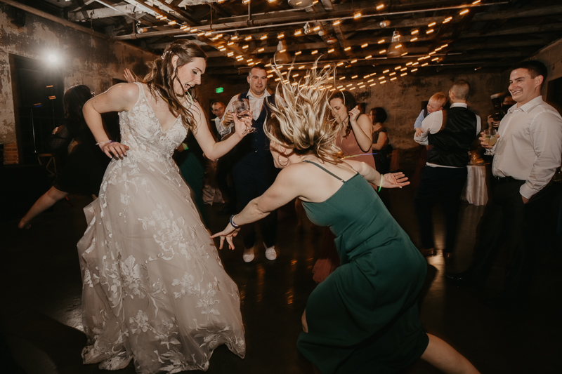 A bright and light filled evening wedding reception by District Remix DJs at the Mt. Washington Mill Dye House in Baltimore, Maryland by Britney Clause Photography