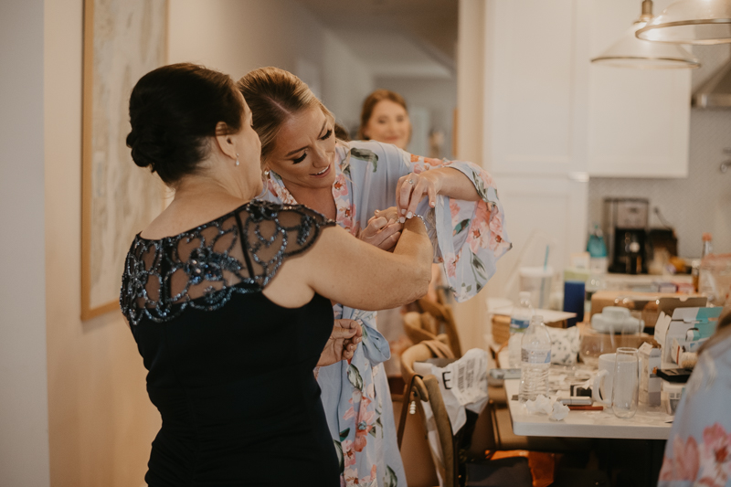 A bride getting ready at a private residence for an Annapolis Waterfront Hotel Wedding in Annapolis, Maryland by Britney Clause Photography