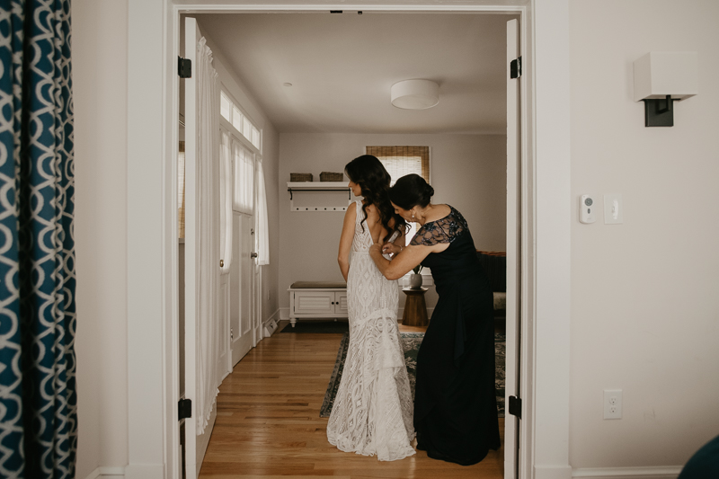 A bride getting ready at a private residence for an Annapolis Waterfront Hotel Wedding in Annapolis, Maryland by Britney Clause Photography