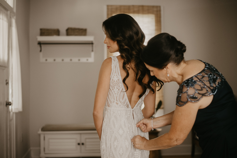 A bride getting ready at a private residence for an Annapolis Waterfront Hotel Wedding in Annapolis, Maryland by Britney Clause Photography