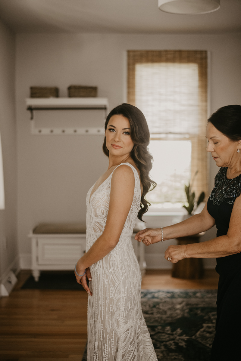 A bride getting ready at a private residence for an Annapolis Waterfront Hotel Wedding in Annapolis, Maryland by Britney Clause Photography