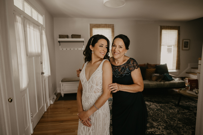 A bride getting ready at a private residence for an Annapolis Waterfront Hotel Wedding in Annapolis, Maryland by Britney Clause Photography