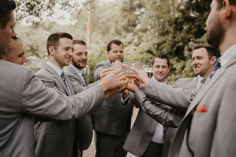 A groom getting ready at a private residence for an Annapolis Waterfront Hotel Wedding in Annapolis, Maryland by Britney Clause Photography