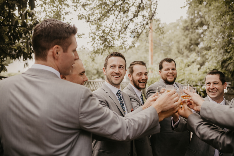 A groom getting ready at a private residence for an Annapolis Waterfront Hotel Wedding in Annapolis, Maryland by Britney Clause Photography