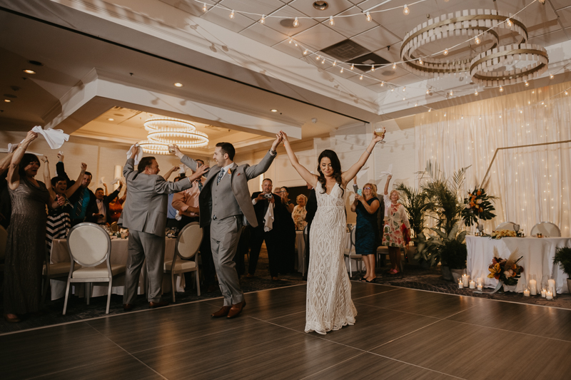 An exciting evening wedding reception by Toussaint Productions at the Annapolis Waterfront Hotel in Annapolis, Maryland by Britney Clause Photography