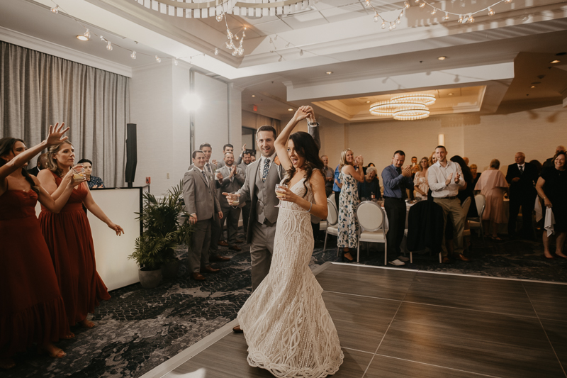 An exciting evening wedding reception by Toussaint Productions at the Annapolis Waterfront Hotel in Annapolis, Maryland by Britney Clause Photography