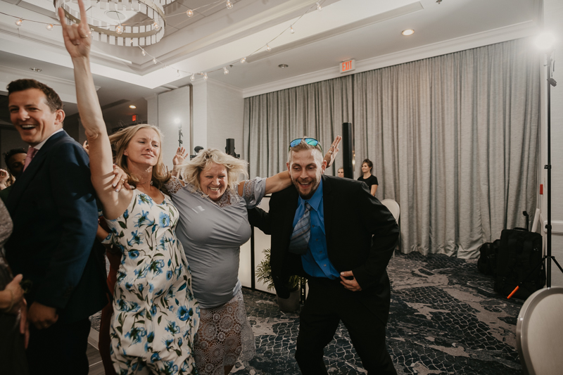 An exciting evening wedding reception by Toussaint Productions at the Annapolis Waterfront Hotel in Annapolis, Maryland by Britney Clause Photography