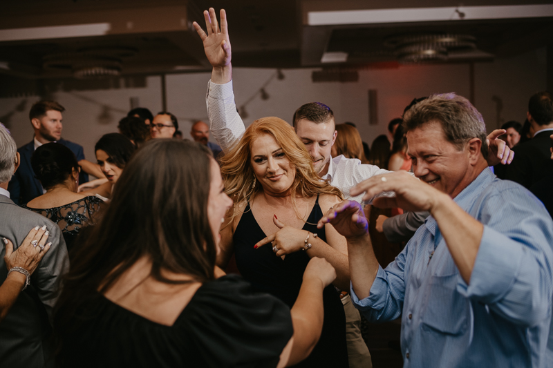 An exciting evening wedding reception by Toussaint Productions at the Annapolis Waterfront Hotel in Annapolis, Maryland by Britney Clause Photography