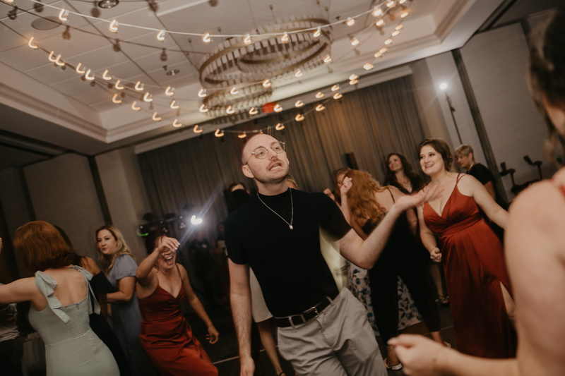 An exciting evening wedding reception by Toussaint Productions at the Annapolis Waterfront Hotel in Annapolis, Maryland by Britney Clause Photography