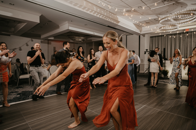 An exciting evening wedding reception by Toussaint Productions at the Annapolis Waterfront Hotel in Annapolis, Maryland by Britney Clause Photography