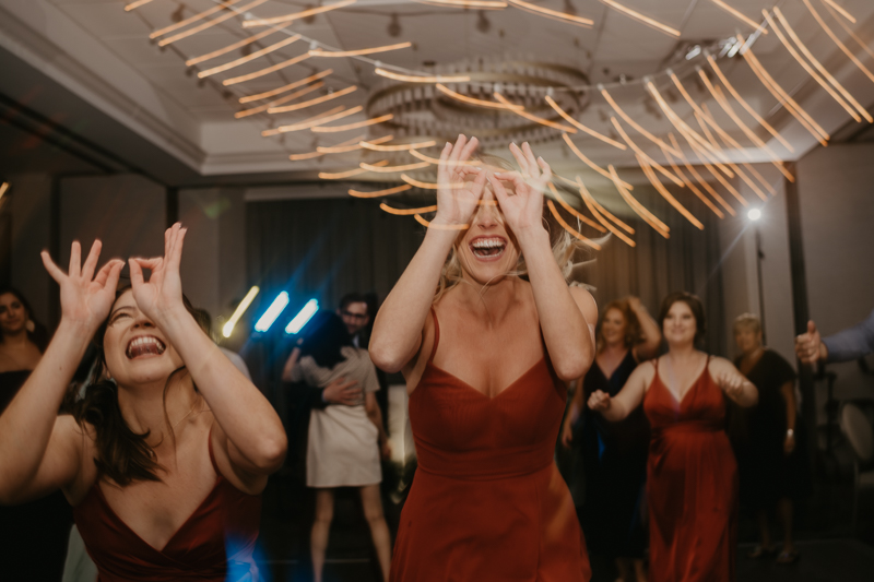 An exciting evening wedding reception by Toussaint Productions at the Annapolis Waterfront Hotel in Annapolis, Maryland by Britney Clause Photography