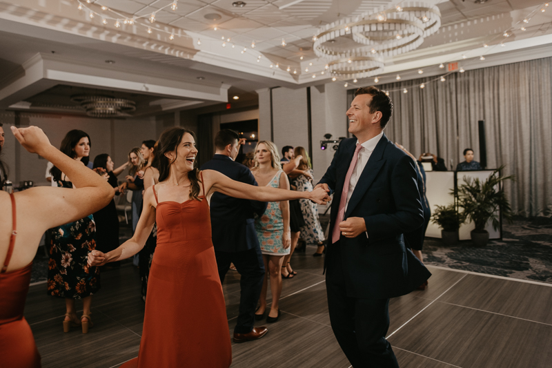 An exciting evening wedding reception by Toussaint Productions at the Annapolis Waterfront Hotel in Annapolis, Maryland by Britney Clause Photography