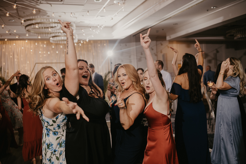 An exciting evening wedding reception by Toussaint Productions at the Annapolis Waterfront Hotel in Annapolis, Maryland by Britney Clause Photography