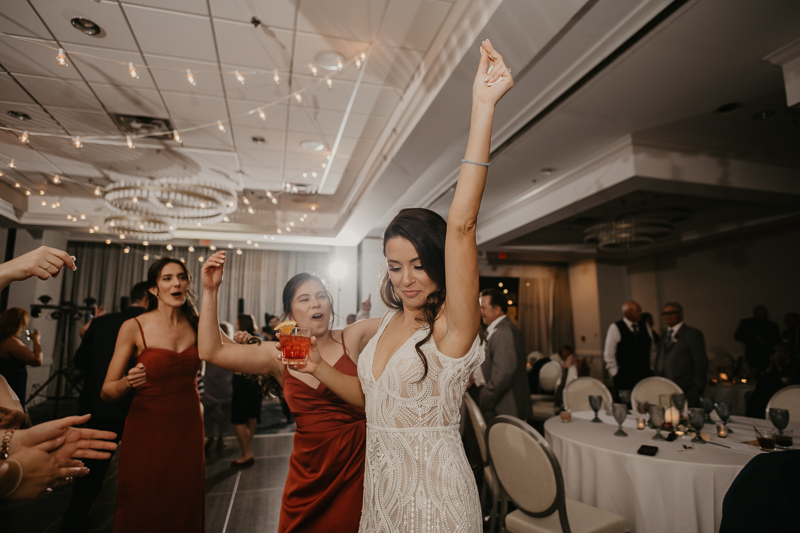 An exciting evening wedding reception by Toussaint Productions at the Annapolis Waterfront Hotel in Annapolis, Maryland by Britney Clause Photography