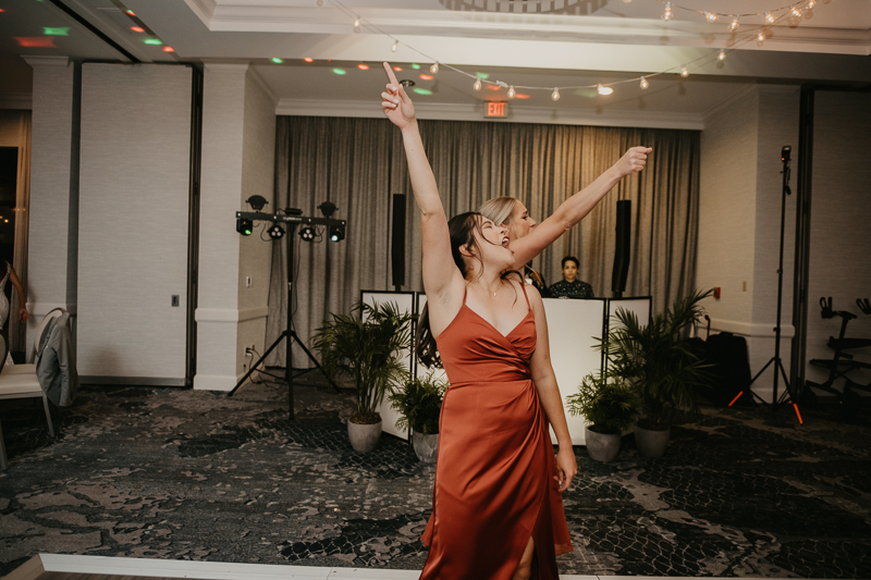 An exciting evening wedding reception by Toussaint Productions at the Annapolis Waterfront Hotel in Annapolis, Maryland by Britney Clause Photography