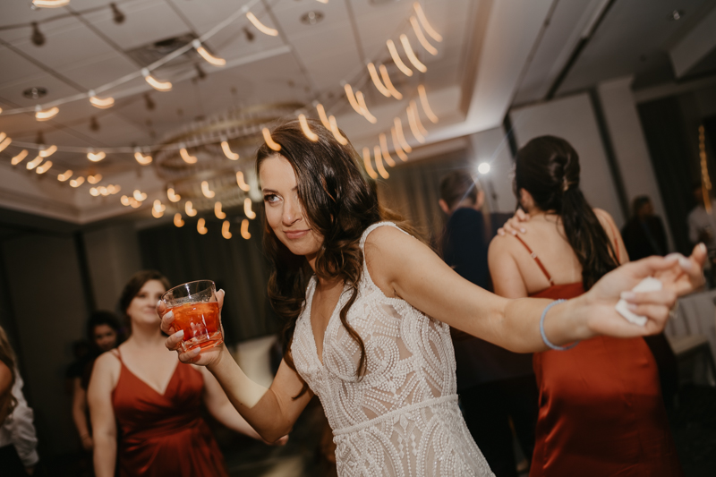 An exciting evening wedding reception by Toussaint Productions at the Annapolis Waterfront Hotel in Annapolis, Maryland by Britney Clause Photography