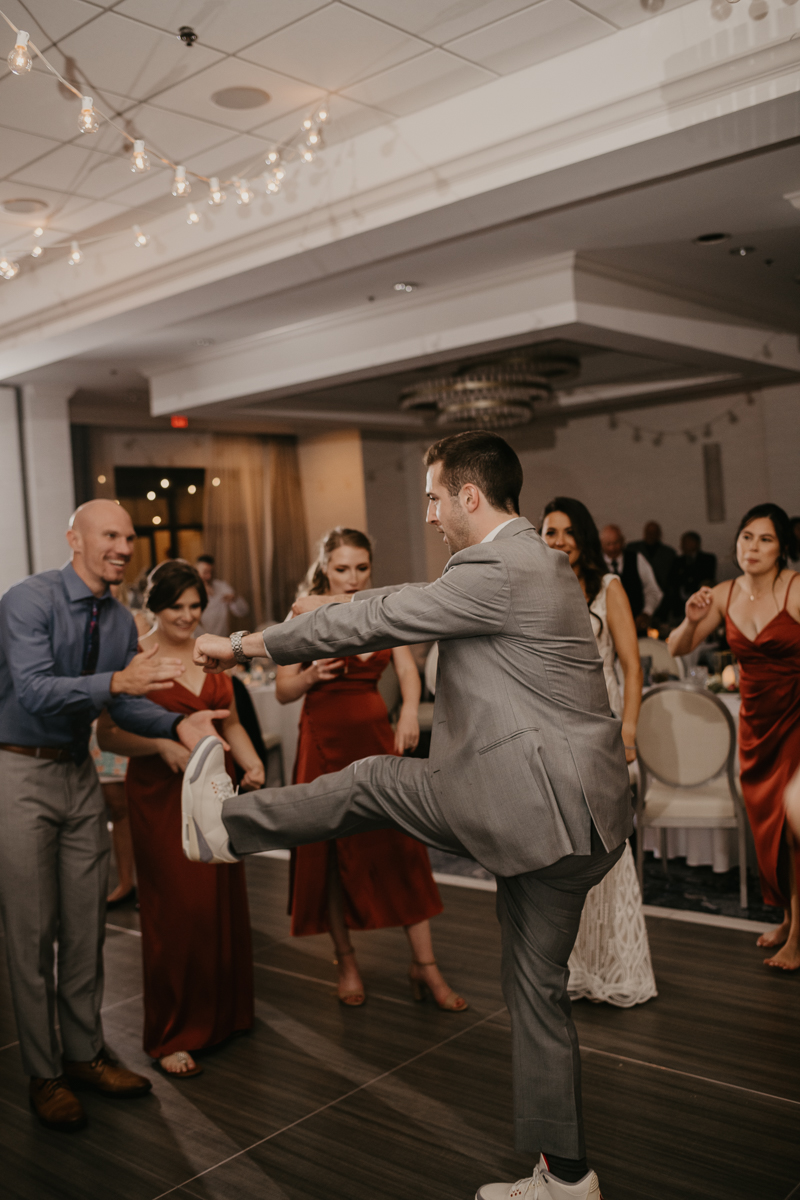 An exciting evening wedding reception by Toussaint Productions at the Annapolis Waterfront Hotel in Annapolis, Maryland by Britney Clause Photography