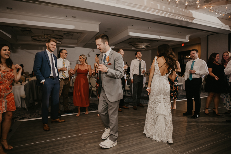 An exciting evening wedding reception by Toussaint Productions at the Annapolis Waterfront Hotel in Annapolis, Maryland by Britney Clause Photography