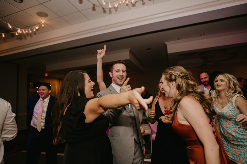 An exciting evening wedding reception by Toussaint Productions at the Annapolis Waterfront Hotel in Annapolis, Maryland by Britney Clause Photography