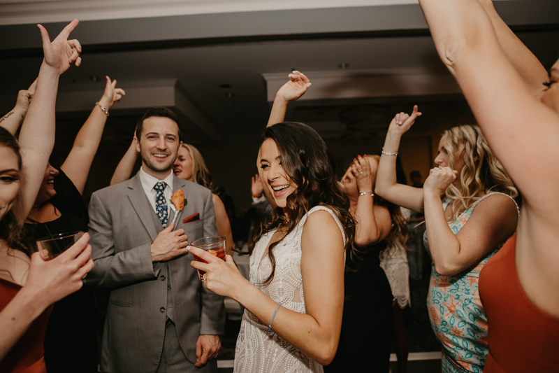 An exciting evening wedding reception by Toussaint Productions at the Annapolis Waterfront Hotel in Annapolis, Maryland by Britney Clause Photography