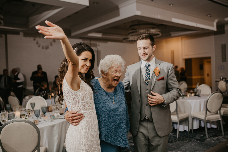 An exciting evening wedding reception by Toussaint Productions at the Annapolis Waterfront Hotel in Annapolis, Maryland by Britney Clause Photography