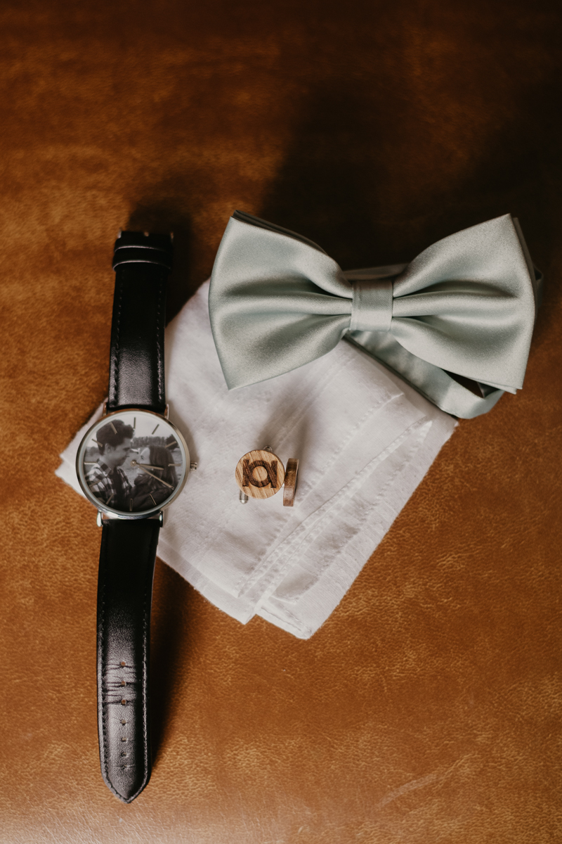 A groom getting ready at the Liriodendron Mansion in Bel Air, Maryland by Britney Clause Photography