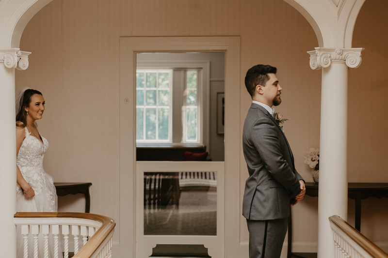 A sentimental bride and groom First Touch at the Liriodendron Mansion in Bel Air, Maryland by Britney Clause Photography