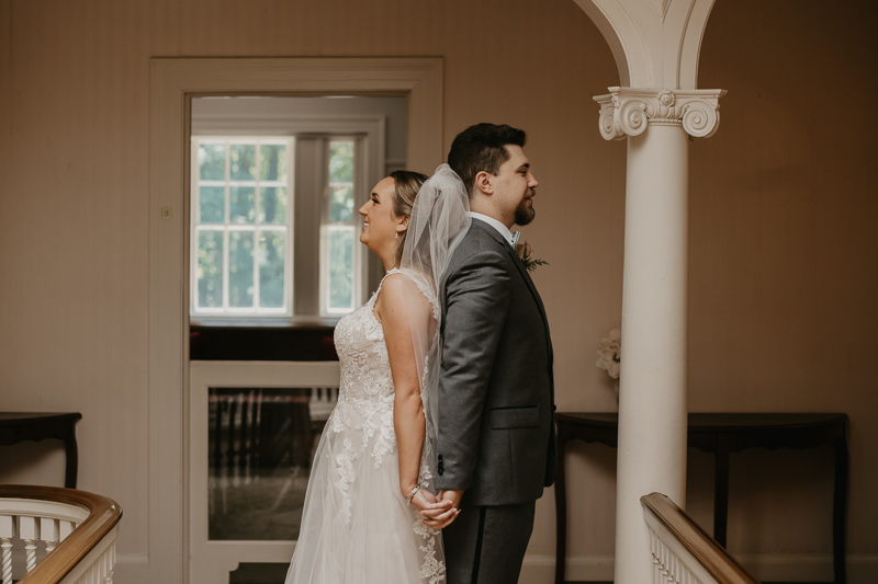 A sentimental bride and groom First Touch at the Liriodendron Mansion in Bel Air, Maryland by Britney Clause Photography