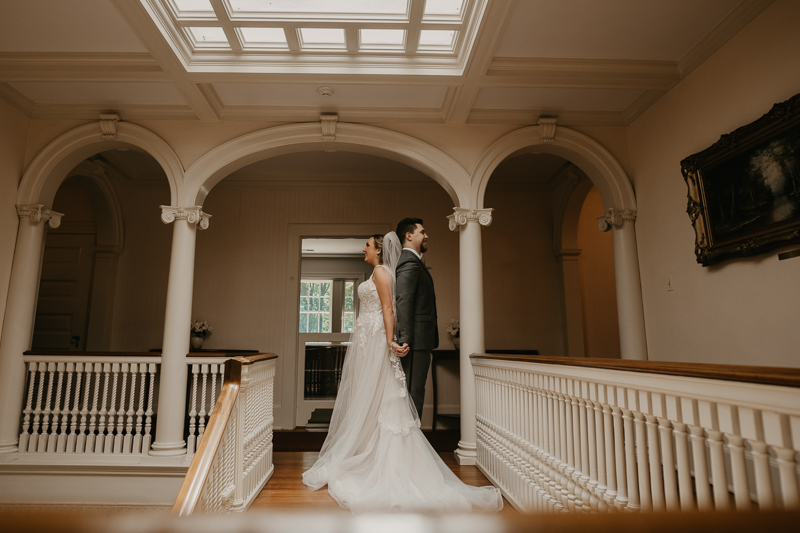 A sentimental bride and groom First Touch at the Liriodendron Mansion in Bel Air, Maryland by Britney Clause Photography