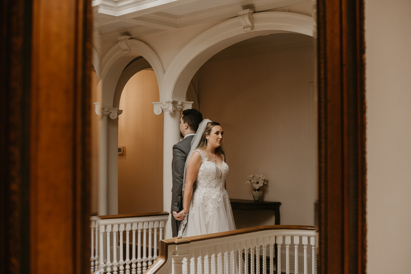 A sentimental bride and groom First Touch at the Liriodendron Mansion in Bel Air, Maryland by Britney Clause Photography